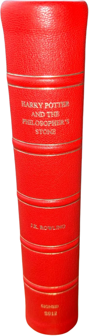 Spine, gold-lettered with J.K. Rowling's signature